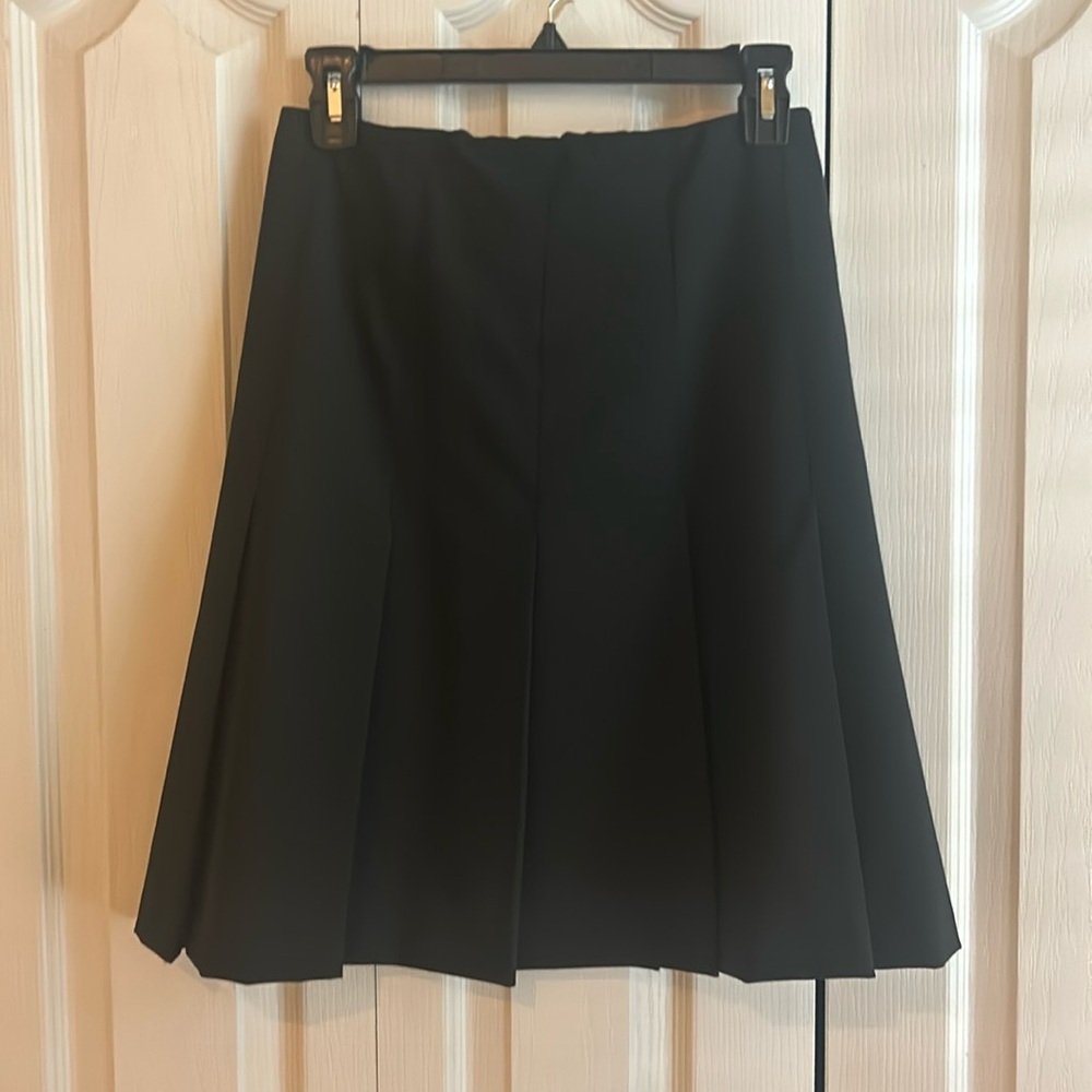Trendy black skirt with pleats, fully lined. Looks great with any type of top.